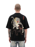 Leopard Clash oversized tee by IKIINK - front